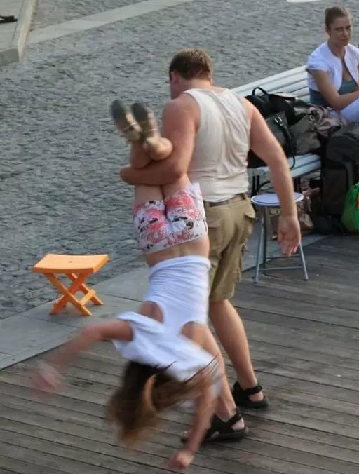dragged toward a stool for a public spanking by an angry man
